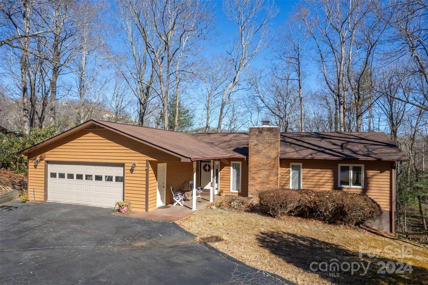 ONE-LEVEL LIVING in lovely Stonebrook neighborhood, just north of downtown Hendersonville and offering convenient commutes to Asheville, airport and interstate. This quiet, gently sloping property on a cul-de-sac road is designed for relaxation! Home overlooks mature woods to provide you with a mix of sun and shade. Inside, the split-bedroom floorplan features a primary bedroom with full bath and two walk-in closets on one side, and two bedrooms with large closets and a full bath on the other. In the center of the home, there's a well-equipped kitchen with pantry, living room with wood-burning fireplace, and a nicely sized dining area with access to the back deck overlooking the woods. A convenient laundry room leads to a large, two-car garage, and the driveway offers easy access coming and going. New radon mitigation system and crawlspace vapor barrier!