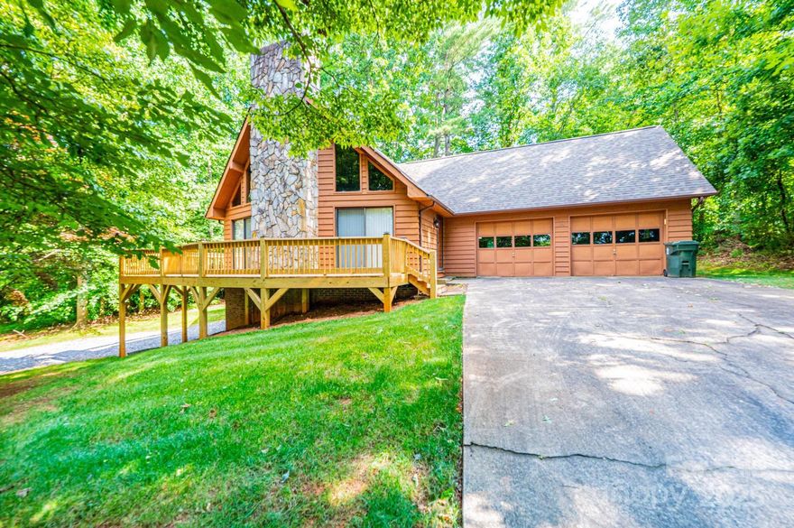 Back on the market – improvements complete. Beautiful A-frame home in Hudson featuring 3 bedrooms and 3 full baths with tons of charm. The main floor includes a spacious living room with a breathtaking stone fireplace, a primary suite, and an additional full bath. Updates to flooring and baths. A roomy 2-car garage is conveniently located off the main level. Upstairs offers two more bedrooms, a full bath, and a cozy sitting area off the stairwell. The basement includes a finished den and a great shop or storage space. Gas furnace (2020) and heat pump (2017). Roof is only 2 years old. Public water and sewer through the City of Lenoir. A beautiful wraparound deck is perfect for morning coffee or evening entertaining. Ask for a list of additional improvements.