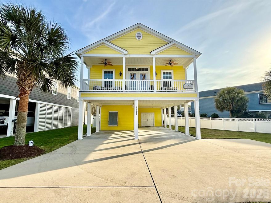 Prepare to be impressed with this beautifully decorated and maintained beach home located in the Cross Island area between the intracoastal and Cherry Grove. The lower level offers covered parking for 3 vehicles and a convenient rinse station outdoor shower with an entryway/dropzone and a fantastic flex space currently used as a golf cart garage and storage. If you choose to finish for added living space, there is already a kitchenette and full bath on this lower level. The laundry room has an over-sized storage closet that is prepped to be an elevator shaft if you desire one. Upstairs, you'll enter a gorgeous great room with vaulted ceilings, engineered hardwoods and a beautiful eat-in kitchen and dining area. The kitchen has granite and tiled backsplash, stainless appliances and French doors that lead to a covered front porch. The charming arched doorways lead down the hall to the 3 bedrooms and 2 full baths complete with tiled showers, decorative tiled backsplash and 9 foot ceilings. This one is a do not miss! Appliances remain in both kitchens and the washer and dryer downstairs. Priced to sell!!