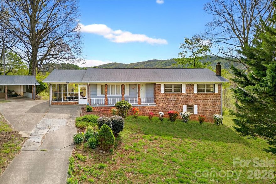 Awesome location and amazing views!  Freshly professionally painted throughout!! A brick ranch that is low maintenance and a full sized basement featuring 3 bedrooms and 2 full baths on the main floor.  A spacious living room allows for multiple furniture pieces to be able to sit and enjoy as well as host friends & family which opens to the dining room that has plenty of space as well as two large closets for ample storage.  Nice sized kitchen complete with range, dishwasher & refrigerator that all convey. Kitchen window looking out for some of the terrific views!  Beautiful hardwoods and newer quality carpet throughout the main floor.  An exceptional feature is the large screened porch just off of the kitchen allowing for enjoying all seasons and taking in views!  The basement has a big den which includes a woodstove for auxiliary heat or for extra warmth during the colder months.  There is also a room that can be an office/study or use as a bedroom if needing to change up how to use the floorplan.  Another room that could be a game room or convert to a media room etc.  Then there is the laundry area as well as a massive storage area.  Awesome newer deck with fantastic views off the back of the home, a detached carport, a detached 24x24 garage/shop with water & electricity as well as a fenced flat yard behind the shop!  Multiple ornamentals in the yard and quick access to I-40! Asheville & Hickory are only about a 30 minute drive with Morganton being closer & just a few short minutes from Downtown Marion!  Some Updates include: deck replaced 2021, HVAC 2020, guest bath updated in 2021, dishwasher in 2025 as well as the refrigerator & washer were new in the last several years.  This is a great place to call home!  Selling As-Is