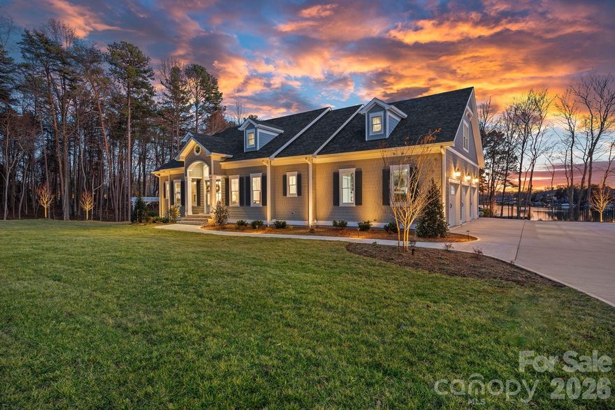Newly built, move-in ready, and priced for today's buyer. This exceptional 2024 new construction estate in The Point delivers the full Lake Norman lifestyle without compromise Enjoy stunning water views from virtually every level, a chef's kitchen with Wolf, Sub-Zero, and dual Cove dishwashers, and craftsman moldings with custom built-ins throughout. The main-level primary suite offers peaceful water views and a custom walk-in closet. Upstairs, three spacious bedrooms surround an open loft with custom built-ins which is equally suited as a refined workspace or quiet reading retreat; plus a versatile flex room and private guest suite with en-suite bath. The fully finished lower level delivers a dedicated office with built-ins, en-suite bedroom, expansive family room, exercise space, and a laundry room with built-ins and chutes from both upper floors. Abundant walk-in storage throughout. Outside, a saltwater pool and spa overlook the lake. Boat slip Pier M #10 is just steps away with dedicated parking, plus private waterfront access for paddleboarding and kayaking. This is The Point at its finest — move in and start living it.
