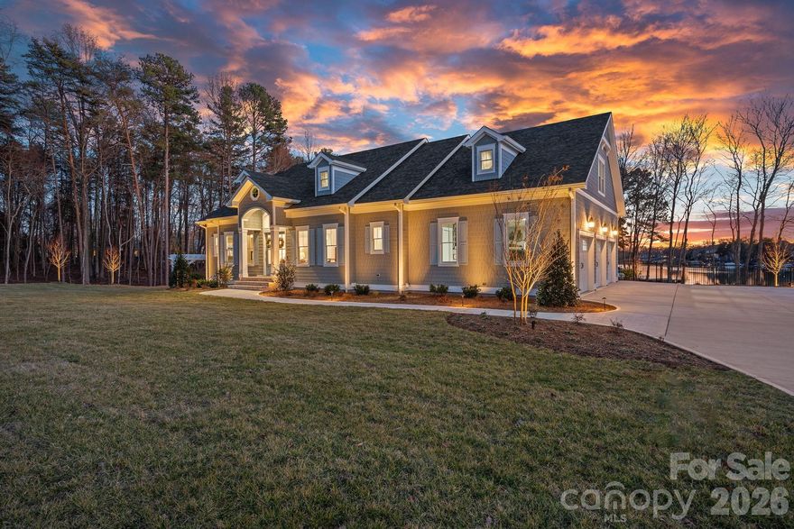 An exceptional opportunity to own a newly built waterfront estate in The Point. Completed in 2024 by Courtland Home Builders, this stunning residence was masterfully designed to embrace effortless lakeside living and refined entertainment. Perfectly positioned to capture expansive water views, the home embraces the beauty and serenity of lakefront living at every turn. Imagine mornings spent paddleboarding from your private waterfront setting and afternoons kayaking into golden sunset skies — this is the lifestyle Lake Norman is known for.

Drenched in natural light, the open-concept floor plan seamlessly connects the main living spaces while framing stunning lake views. The chef’s kitchen is the heart of the home, featuring an expansive island, custom cabinetry, and luxury appliances including Wolf, Sub-Zero, and dual Cove dishwashers. Extensive built-ins and exquisite moldings add architectural interest and timeless character throughout.

The main-level primary suite offers peaceful water views and a custom walk-in closet that truly impresses — thoughtfully designed and with space to accommodate a future stackable washer and dryer for added convenience.

Upstairs, three spacious bedrooms are complemented by an open loft with custom built-ins, offering endless possibilities — from a refined workspace to a quiet reading retreat. A versatile flex room with barn door provides additional space for an office, playroom, or den. A private guest suite with en-suite bath ensures comfort and privacy for visitors.

The fully finished lower level continues the home’s thoughtful design, offering a dedicated office with built-ins, en-suite bedroom, expansive family room, exercise/flex space, and a laundry room with built-ins and complete with laundry chutes from the upper two floors. Abundant walk-in storage adds to the home’s functionality.

Outdoor living is where this waterfront property truly shines. A saltwater pool and spa overlook the lake, creating a resort-style setting for sunset evenings, weekend gatherings, or quiet mornings by the water. The property includes boat slip Pier M #10, just a short walk away, with dedicated parking available — completing the ultimate Lake Norman boating lifestyle.

An exceptional blend of luxury, functionality, and true waterfront living — this is The Point at its finest.