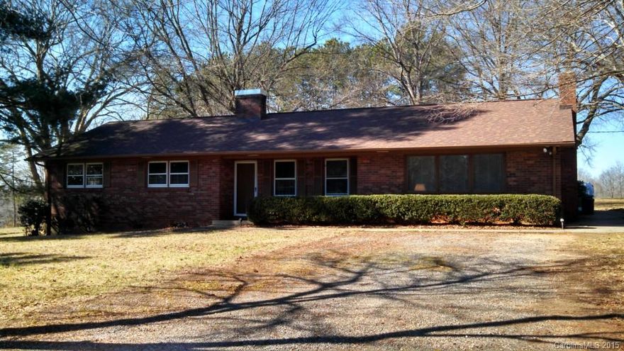 Charming full brick ranch. Situated on a level, well maintained, 1.81 acre lot with quiet surroundings. Spacious den has wood burning fireplace with wood stove. Beautiful hardwood floors in master bedroom and in large living room. Trane HVAC system. Roof is approximately 4 years old.   Close proximity to Statesville, Troutman and Mooresville.  Conveniently located within 10 minutes of both I-77 and I-40.