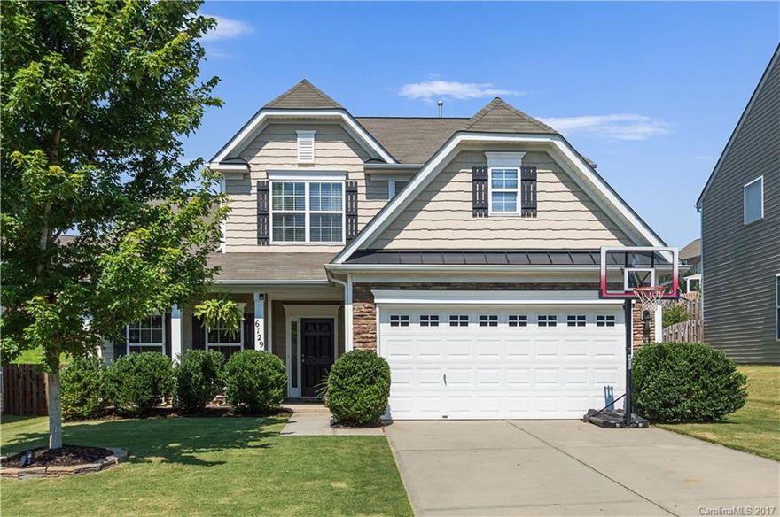 Awesome four bedroom home in turn key condition.  Open floor plan with huge kitchen flowing into family room.  Great space for entertaining.  This home's greatest feature is the master down bedroom with amazing master bath. Laundry room on the first floor.  Check out the back yard!  Total privacy with lots of green space.