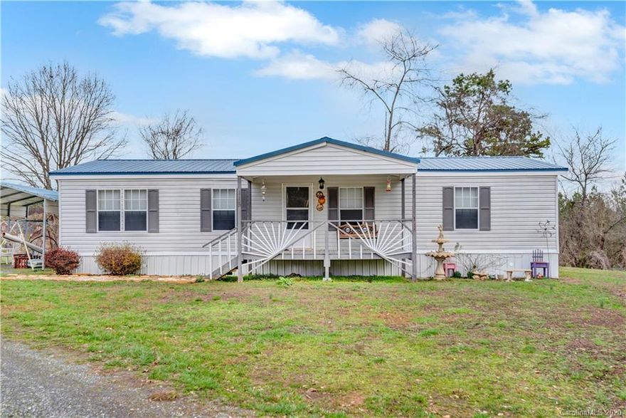 Dreaming of country living? Then this property is perfect for you! Very well maintained double wide manufactured home sits on almost an acre of open/cleared land.