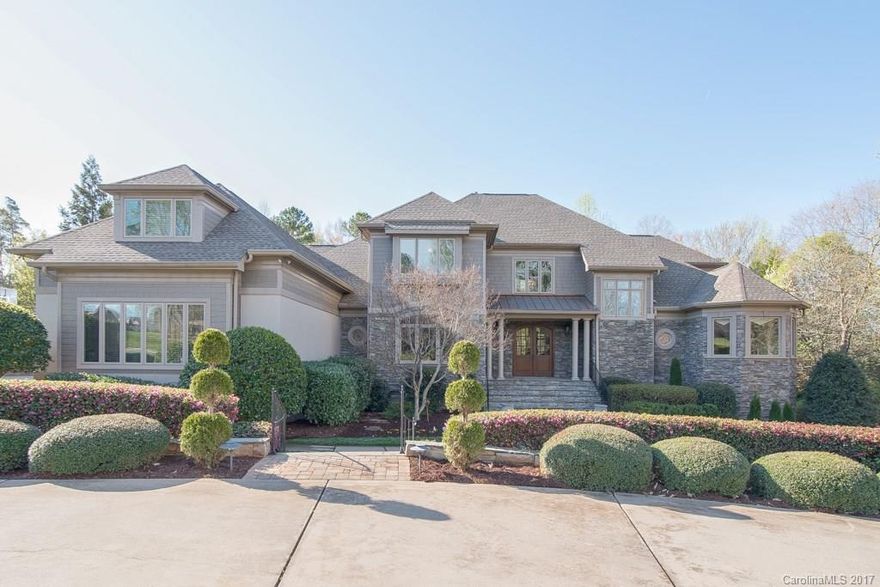 Private resort like living in Firethorne CC. Beautiful custom basement hm with wrap around covered terrace overlooking heated pool/spa as well as golf course. Stunning one of a kind hm with exquisite details throughout and extensive stone work. Endless features include a media rm, exercise rm, 2 wet bars, 2nd kitchen and 2nd laundry to service pool, 2 rec rms, custom closets, all BRs have bath access, abundance of storage, large windows, 2 frpls, circular driveway. Unique, elegant hm has it all.