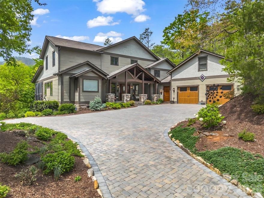 Welcome to this stunning custom Arts & Crafts mountain retreat nestled in the sought-after community of Firefly Cove. Thoughtfully designed to embrace its breathtaking surroundings, this exceptional home offers the perfect blend of craftsmanship and elevated mountain luxury living. A dramatic wall of windows fills the soaring great room with natural light, showcasing panoramic views of Chimney Rock State Park and the surrounding Blue Ridge landscape.

The new and improved chef's kitchen is both functional and impressive, now featuring a premium Fulgor Milano induction range, built-in air fryer, Subzero refrigerator, a second sink, and an oversized island ideal for entertaining or everyday luxury living.

The spacious primary suite offers a true private retreat, now elevated with a spa-inspired sauna and direct access to a screened porch complete with its own fireplace—perfect for relaxing evenings.

Step outside to experience thoughtfully curated outdoor living at its finest, featuring a custom firepit gathering area paired with a dedicated stargazing deck—perfectly positioned to take in the serene mountain setting and night skies.

Additional highlights include a full-house generator for peace of mind, generous guest accommodations, a bonus room above the garage, and private community access to Lake Lure. With a new stone-paved driveway and exceptional attention to detail throughout, this remarkable home has been extensively enhanced with over $200,000 in recent upgrades, offering a truly turnkey luxury mountain lifestyle.