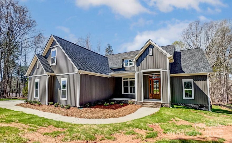 Welcome to 4262 Brandy Creek Ct, a stunning new construction home in the highly sought-after Sanders Landing community! Located in the top-ranked Clover School District, this beautifully designed home offers a spacious split floor plan with an open-concept kitchen and living area. Modern finishes throughout include quartz countertops, a white fireclay farmhouse sink, painted ceilings, and elegant crown molding. The primary suite features dual entrances for seamless access to the laundry room and kitchen, adding a touch of convenience to everyday living. The inviting front entrance sets the tone, while the expansive back porch is perfect for unwinding or entertaining. This is currently the only active listing in the subdivision—a rare opportunity! With low HOA fees and lenient restrictions, this home provides the perfect balance of community and flexibility. Don't miss your chance to own this exceptional home—schedule your tour today!