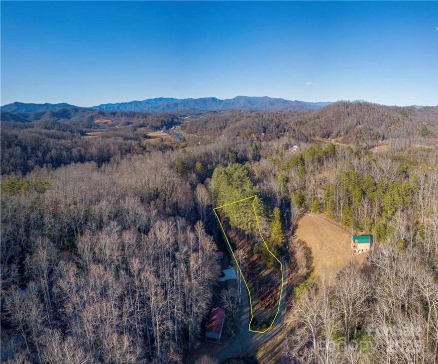 Level lot near Bryson City - .86 acres, unrestricted - mobile homes allowed. Septic evaluation and recent survey on file.