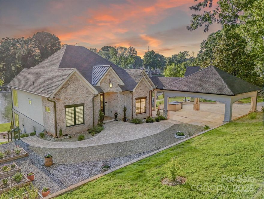Waterfront living at its best! This Custom, Lake Norman Home was completely remodeled from the foundation up in 2023 and offers .8 acres and 235 ft of deep-water frontage on a rare double lot—no HOA. Enjoy long cove views, quick main channel access, grandfathered boat ramp, and waterside pavilion with pool potential. Set just 30 ft from the waterline, the home offers stunning views from nearly every room. The Chef’s Kitchen includes Wolf Double Ovens and Range, Cambria Quartz Counters, and a large pantry. A covered deck off the kitchen extends dining outdoors. The lake-level is made for entertaining, with a second kitchen, game room, and 12-ft slider to the lake. Outdoor spaces include large dock with deep water, covered boat lift (10,000 lb. Hi-Lift hoist boat lift with remote) a stone firepit, and covered pavilion, —ideal for gatherings. Also included: a 558 sq. ft. 2021-built waterfront bungalow, perfect for guests or office.