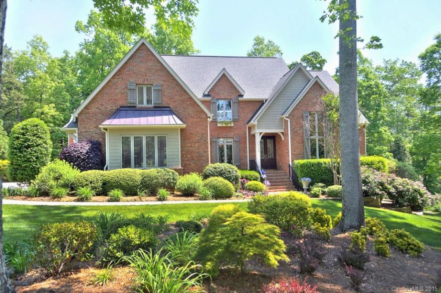Sitting on nearly 2 acres on the golf course w/ waterviews this impressive 3 sty full brick home w/ boat slip and room for a pool is arguably the BEST value in the Point First impressions matter- meticulously maintained, an abundance of natural light,gorgeous hwd flrs; wall of windows,a library w/ cathedral ceilings & custom wainscoting,gourmet kitchen open to the FM and outdoors.Mstr on main w/ XL closet.Upper offers bonus rooms & in law suite. LL offers excercise, LGE storage & summer kitchen.