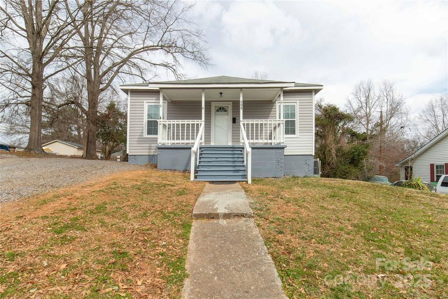 Remodeled 3 bedroom, 2 bathroom with Living Room and additional Den/Office space in Clover.  New- laminate floors throughout, fresh paint, 95% of all windows replaced, light fixtures, new bath vanities, new garage doors & openers, new HVAC system, and insulation added to crawl space.  Kitchen cabinets have been painted.  Spacious kitchen w/eat-in area, lots of cabinets & counterspace, pantry & all appliances remain plus the washer & dryer.  The washer & dryer is located in a large closet just off the kitchen.  Split bedroom plan w/2 bedrooms on the front of the home and a den/office w/access to side deck & primary bedroom in the rear of the home.  The primary bedroom has access to the rear deck overlooking the backyard.  The whirlpool tub/shower has tile look vinyl surround.  Outside there is a covered front porch & a two car wired detached garage & storage building.  Lots of concrete for parking behind the home.  Great location to schools, churches, parks, shopping & restaurants.