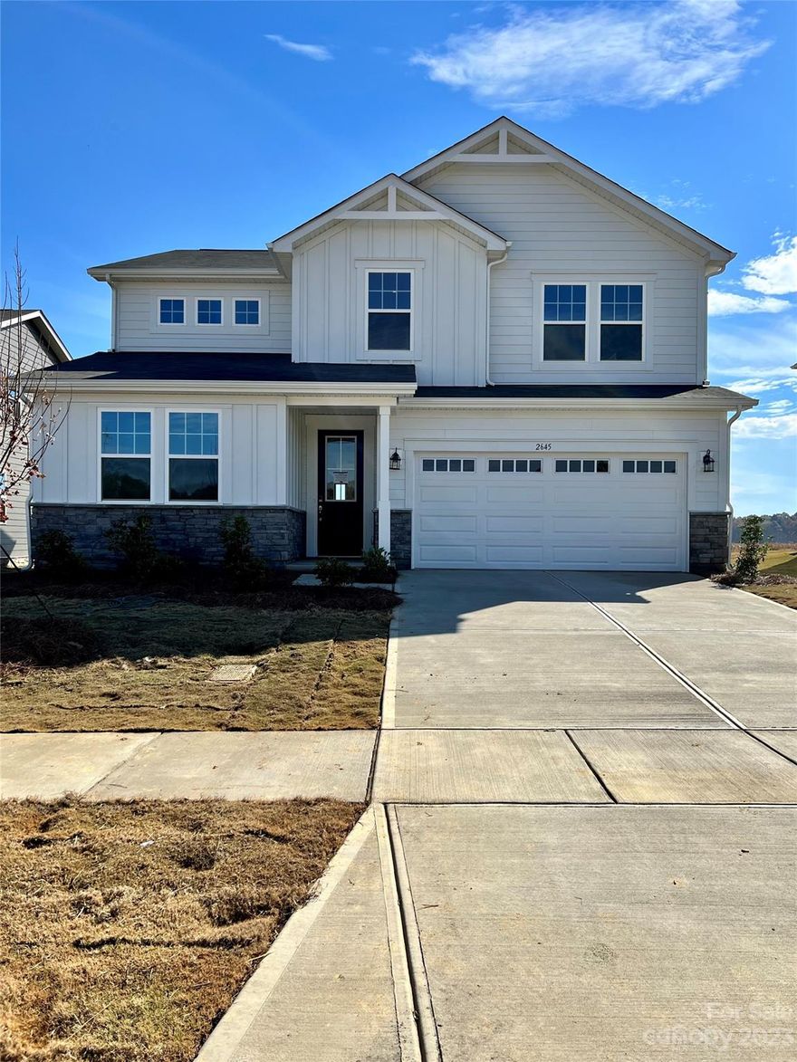 Ready now!!!  5 bedroom, 4 full bathrooms and 2 car garage home.  Exterior is hardi-board with stone accent, covered front porch.  1st floor has a guest suite, full bath, study with french doors.  Huge Kitchen with oversized island with quartz countertops, tons of upgraded cabinets, pendant lights over island and stainless steel appliances.  Fireplace in great room, tons of windows for natural light.  8ft sliding glass doors to covered veranda.  Enjoy the yard space off back for grilling and entertaining.  On the 2nd floor will be a large recreational room for movies or game area.  Owners suite with trey ceilings, walk in closet.  Owners bathroom has separate shower and soaking tub with large window over the tub.  Down the hall will be a bedroom with private bathroom and walk in closet.  2 additional bedroom with hall bath.  
Community is 10 mins to downtown Waxhaw and easy access to uptown Charlotte. Community will offer swimming pool, cabana, pocket park/ opening summer of 2024.