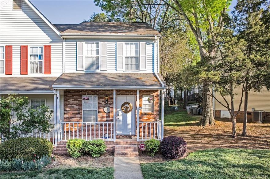 Adorable end unit w/ covered porch; very spacious open plan w/ wood laminate floors, bright kitchen, fresh neutral paint throughout, updated light fixtures. Two huge bedrooms each w/ private bath. Laundry up w/ full size washer/dryer.  Easy entertaining w/ shaded deck. So convenient to shopping and restaurants.  2 parking spaces, affordable HOA dues and a home warranty! This one won't last - Don't Miss It!