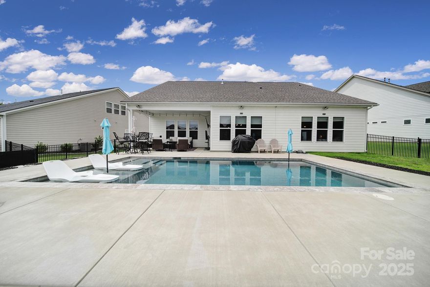 Welcome to 3255 Split Rail Lane! This stunning 4-bedroom, 4-bath home sits right on the border of Indian Land and belongs to the highly sought-after Indian Land school district. Inside, you’ll find an expansive open floor plan with a chef’s kitchen featuring top-of-the-line appliances—perfect for both everyday living and entertaining. Sun-filled living areas create a warm, inviting atmosphere, while the main-level primary suite offers a luxurious retreat. Three additional bedrooms and a large upstairs bonus room provide flexible space for work, play, or relaxation.
Step outside to your private backyard oasis with a heated saltwater pool complete with sun shelf, LED lighting, and a Pebble-Tec finish. Bent Creek residents also enjoy resort-style amenities, including a clubhouse, fitness center, pool, playground, dog park, and scenic walking trails. All this, plus convenient access to top-rated schools, shopping, and dining. Don’t miss your chance to own in Bent Creek—schedule a tour today!