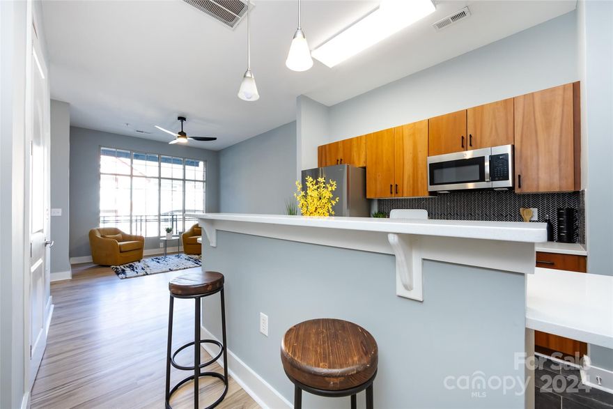 OFFER DEADLINE: HIGHEST AND BEST DUE BY FRIDAY 3/22 AT 5PM.Embrace the vibrancy of Uptown Charlotte without compromising on serenity! This beautifully updated 2-story condo is MOVE-IN READY! One of only a few two story floorplans which means ~ EXTRA SQFT of living space ~ a half bath on main living floor ~ 2 full owner en suites with walk-in closets ~ no neighbors above or below ~ and it is an END UNIT! Includes PRIME PARKING  close to stair/elevator area.  The interior features an open floor plan with large windows and tons of natural light. Kitchen has gorgeous quartz countertops, new stainless appliances and sink! Each bedroom boasts an en suite bath w/ walk-in closet! Easy access to the courtyard makes this unit great for grilling out and entertaining! Lives and looks like a brand new unit! HVAC is only 3 years old! This is one of only a few units that includes a separate secure STORAGE UNIT, perfect for bikes! The BEST unit in the complex!
