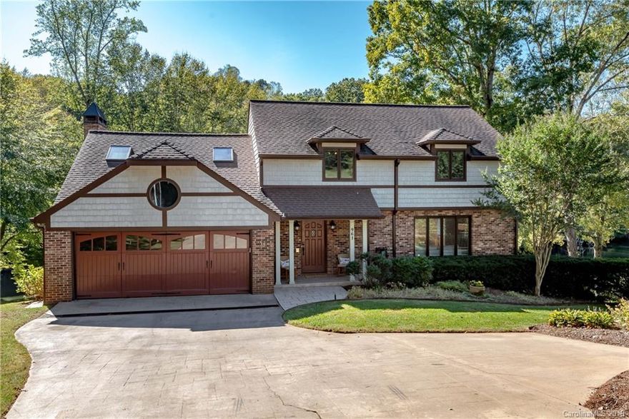 With over 1200+ square feet in the basement alone, this home provides plenty of room to invite the whole family and/or use this basement space as a separate living quarter!   Lakefront living in the desirable Viewmont area of Hickory.  Whether coming by boat or car, it's easy to get to 961 24th Ave Drive NW.  The main level boosts an awesome open kitchen, breakfast area and den area that opens up onto the deck.  Room to play games, enjoy the gas fireplace and make memories in the kitchen. When you have guests over, this is where your people will congregate!  The easy flow from lake, to back deck, to the den and then the kitchen.  Past the kitchen is a dining room with spectacular views of the lake and then the front living room. Main living area has dark Brazilian hardwoods throughout. Upstairs you will find 4 bedrooms, two full baths and a loft area that works great as a playroom, an office or a craft space. You will be impressed by the amount of storage this home has! Come see!