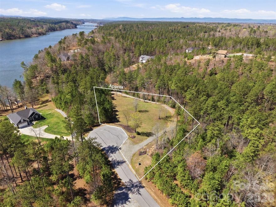 Discover this exceptional 1.61-acre WATERFRONT & DOCKABLE lot in the highly desirable, gated Edgewater community on Lake Rhodhiss. Beautifully maintained and thoughtfully prepared, this property features a gorgeous established building site, a gentle slope to the water, and a gravel driveway leading to an oversized picnic and family area. It is a rare combination that makes this homesite truly stand out.
Whether you’re planning a full-time residence or a weekend retreat, this property offers the perfect blend of privacy, natural beauty, and recreation. Lake Rhodhiss is known for its clean, clear water and is ideal for fishing, boating, water skiing, wakeboarding, paddle boarding, swimming, kayaking, and canoeing—all from your own backyard.
Location Highlights
•  Prestigious gated community with beautifully maintained surroundings
•  Gentle topography ideal for building
•  Established driveway and outdoor gathering area already in place
•  Convenient access to shopping, dining, and medical facilities in Granite Falls and Hickory
•  Easy travel to Charlotte, Asheville, and Blowing Rock
This is one of the most attractive and well-prepared waterfront opportunities in Edgewater. Schedule your private showing today and start planning your dream home on Lake Rhodhiss