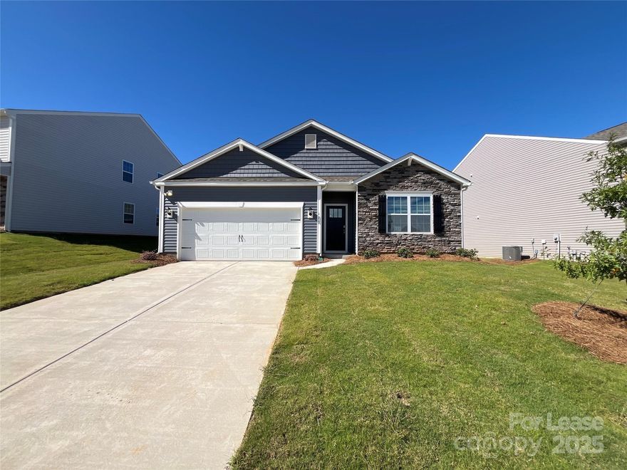 Don't miss out on this NEWLY BUILT 4 bed, 2 bath, 1,764 sq. ft. ranch home with a 2 car garage! Entertain in comfort with an awesome, open-plan great room and kitchen featuring a cozy gas fireplace and a center island breakfast bar! Upgrades include luxury vinyl plank flooring, quartz countertops, stainless steel appliances and a corner pantry. *Please note: a refrigerator will be provided upon move-in. Enjoy the seasons on your covered back porch! The primary bedroom boasts an en suite bath with a dual sink vanity, walk-in shower and a walk-in closet. Three additional bedrooms share a second full bath.