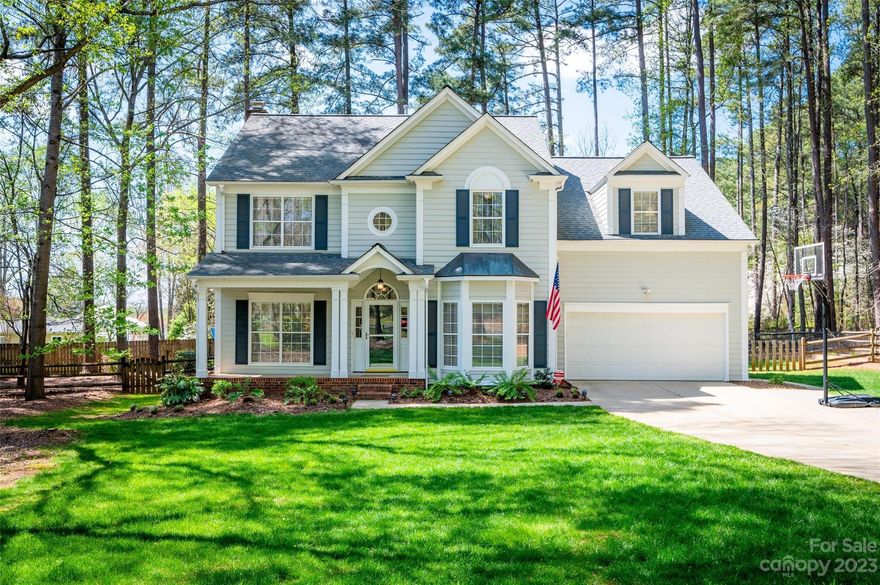 Welcome Home! You'll be impressed from the moment you step into the dramatic 2-story foyer. Wonderful floor plan, fresh paint, gleaming hardwood floors, and upgraded moldings throughout main level. Tons of natural light every where you turn. The recently renovated kitchen features a massive island, beautiful custom cabinets, and a gorgeous backsplash. Cozy great room w/french doors leading to the beautiful screened porch w/vaulted ceilings. Don't miss the fabulous mudroom. Upstairs, you'll find a large primary suite w/trey ceilings and luxurious bath, 2 more spacious bedrooms, another full bath, and a huge bonus room that includes the laundry room and a hidden spot perfect for crafts or gaming. New carpet throughout 2nd level. Wooded and flat fenced backyard. Cozy stone firepit, storage shed, and wooden garden area make this yard hard to beat. Cul-de-sac lot. The lake access community features a boat ramp, boat storage, docks, clubhouse, pool, sports court. Hurry in before it's GONE!