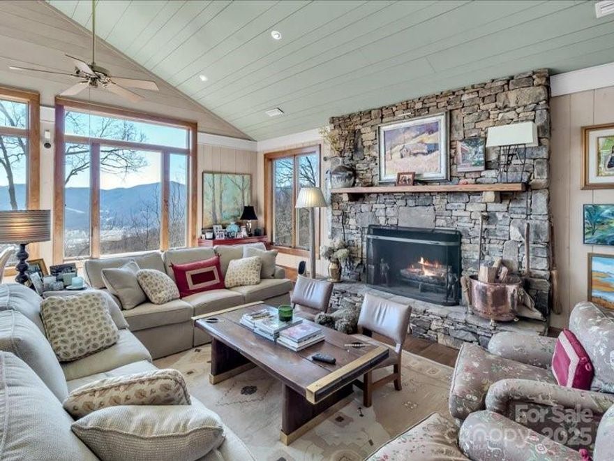 Elegant Private custom Home in desired neighborhood of Laurel Ridge CC. This beautiful home has 180 degree views of the Waynesville area and beyond. The living room and dining room have vaulted ceiling and open to expansive outdoor views. Rock Fireplaces both indoors and out on the deck providing warmth on chilly mornings or evenings. The kitchen has top of the line appliances and plenty of cabinet space Kitchen has an opening to the den and the main room for easy pass thru of drinks or food. Two Dish washers. The large primary suite located on the main floor provides plenty of space with his and hers closets with an additional closet. Additional four bedrooms downstairs provides plenty of privacy and space for extended family members, guest or grand children.
Full house generator, 2 units for hot water on demand. Porch has ipe flouring on the deck. Waterfall with a play house nearby.