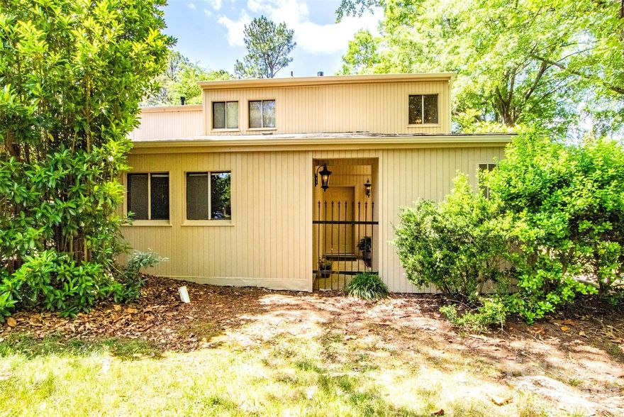 Freshly painted and move-in ready, this inviting end-unit townhome in desirable Raintree offers comfort, convenience, and country club living. Enter through a gated private courtyard that sets the tone for relaxed living. Inside, a spacious floorplan features an updated kitchen with all appliances, ample cabinet and counter space, and a pass-through to the dining area. The Light & Bright Great room showcases a cozy wood-burning fireplace and sliding glass doors that open to a large enclosed private patio, perfect for relaxing or entertaining. The main level includes a bedroom and full bath, ideal for guests or flexible living. Upstairs, the oversized primary suite offers Dual closets and updated bathroom. Additional highlights include a conveniently located kitchen laundry closet, abundant storage throughout, and exterior storage closets off both the front and back patios. Enjoy walkable access to nearby restaurants, shopping, and everyday conveniences. Two assigned parking spaces are just steps from the front door. Located in a highly sought-after South Charlotte area with top-rated schools, this home is an excellent opportunity for a home in a prime South Charlotte location. Tenant can join Raintree Country Club for additional fees. Pets conditional on size and breed with $395 Pet Fee per pet (2 pets max).