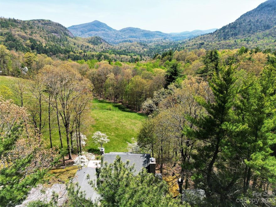 Historic mountaintop farm includes 17.4 sub-dividable acres with an existing 4 bedroom 4 bathroom Farmhouse, 2 car garage, 4 acres of pasture with barn and massive Southwesterly mountain views of incredible Whiteside Mountain. Enjoy gated paved access just 2 miles from the center of Cashiers. Sub-dividable into 8 mountain view parcels, this property offers many unique and rare opportunities. Direct Pedestrian access into the national forest close to big waterfalls. Silver Slip Lake access.