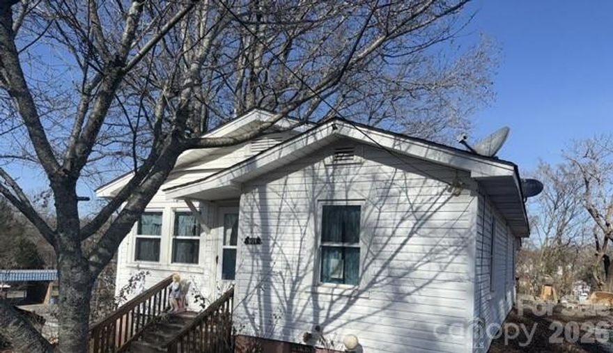 Cozy Cottage in the heart of Marion NC. This single level home offers a floorplan with 2 bedrooms, a centrally located full bathroom, eat-in kitchen, and living room. The covered back deck and level yard are perfectly suited for outdoor enjoyment. This affordable home is close to schools, parks, shopping, and dining.