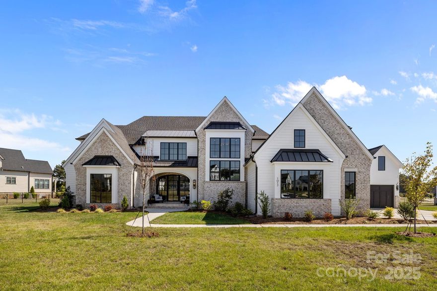 Experience refined luxury in this exceptional 5-bedroom, 5.1-bath residence located in one of the area’s most sought-after communities, served by the highly desirable Marvin school district. As one of the last opportunities to become part of this distinguished neighborhood, this home offers a rare chance to secure your place in a premier setting.

Thoughtfully designed for both elegant entertaining and everyday living, the open and airy floorplan seamlessly blends indoor and outdoor spaces. Expansive living areas flow effortlessly to a stunning limestone rear lanai, creating the perfect setting for gatherings or quiet evenings overlooking the expansive yard. The first-floor primary suite provides a private retreat with convenience and sophistication, while each additional bedroom offering generous accommodations.

Ideally positioned for executive relocation buyers, this residence offers effortless access to top-tier medical facilities, upscale shopping, fine dining, and Charlotte Douglas International Airport—ensuring both lifestyle excellence and travel convenience. Combining location, design, and exclusivity, this home represents luxury living at its finest.