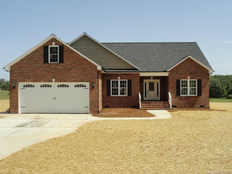 Your dream home in the country! All brick - no maintenance with all the upgrades- beautiful hardwoods in the main area, ceramic tile in the baths and laundry...stainless steel appliances and beautiful maple cabinets!! It is a split bedroom floor plan giving you lots of privacy. Fireplace for those cold evenings...and the pastoral views in your backyard are wonderful. Built by a well-known local builder. Hurry on this one!