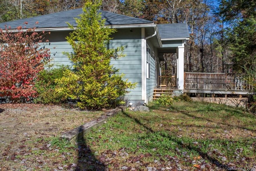 Great home at the end of the road.  This property had great vacation rental history, fenced in area and boarders a creek. It would make a nice place to live or for investment. The sellers would love to sell the property and reinvest in another state. This property has Gravel road with No Maintance agreement.