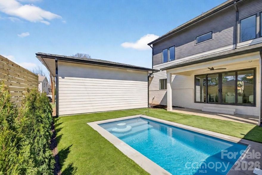 Tucked into one of Charlotte’s most sought-after in-town neighborhoods, this stunning new modern duet delivers the perfect balance of sophisticated design, thoughtful functionality, and unbeatable location. Located in Sedgefield, one of the most established and desirable areas within South End, the home enjoys a prime setting between Park Road and South Boulevard—placing you moments from acclaimed dining, shopping, greenways, and Uptown access, while still offering the charm of a residential neighborhood.
Crafted by Westwood Homes, a respected custom builder known for exceptional quality, attention to detail, and timeless modern design, this newly constructed residence reflects a commitment to elevated living. Clean architectural lines, modern materials, and thoughtful finishes define the exterior, while the interior layout is equally impressive—designed to support both everyday comfort and effortless entertaining.
One of the home’s most coveted features is the primary bedroom located on the main level, making true main-level living a reality. The spacious primary suite offers a private retreat with generous proportions, abundant natural light, and a luxurious en-suite bath designed with modern finishes and spa-inspired comfort. This main-level design provides flexibility and convenience, ideal for long-term living without compromise.
At the heart of the home is a gourmet kitchen that seamlessly blends style and function. Outfitted with modern appliances, custom cabinetry, and sleek surfaces, the kitchen offers an open, airy feel that flows naturally into the main living and dining spaces. Whether hosting gatherings or enjoying a quiet evening at home, the open-concept layout creates an inviting atmosphere that feels both refined and relaxed. Thoughtful sightlines and high ceilings enhance the sense of space, while carefully selected finishes elevate the overall aesthetic.
The home features a total of four bedrooms and three and a half bathrooms, offering flexibility for guests, home offices, or additional living needs. Upstairs secondary bedrooms are generously sized and paired with well-appointed bathrooms, maintaining the same level of craftsmanship found throughout the home. Each space is designed to feel intentional, functional, and cohesive with the modern design language.
Additional highlights include premium fixtures, contemporary detailing, and quality construction throughout—hallmarks of Westwood Homes’ reputation. From the layout to the finishes, every element has been carefully considered to create a home that feels current yet enduring. The inground plunge pool surrounded by maintenance free grass makes the backyard your personal vacation spot.
With its unbeatable Sedgefield location, modern architectural style, and rare primary-on-main layout, this new duet presents a unique opportunity to enjoy refined living in the heart of Charlotte. Surrounded by mature streets, close to South End energy, and built to exacting standards, this residence offers a lifestyle defined by convenience, comfort, and modern elegance.