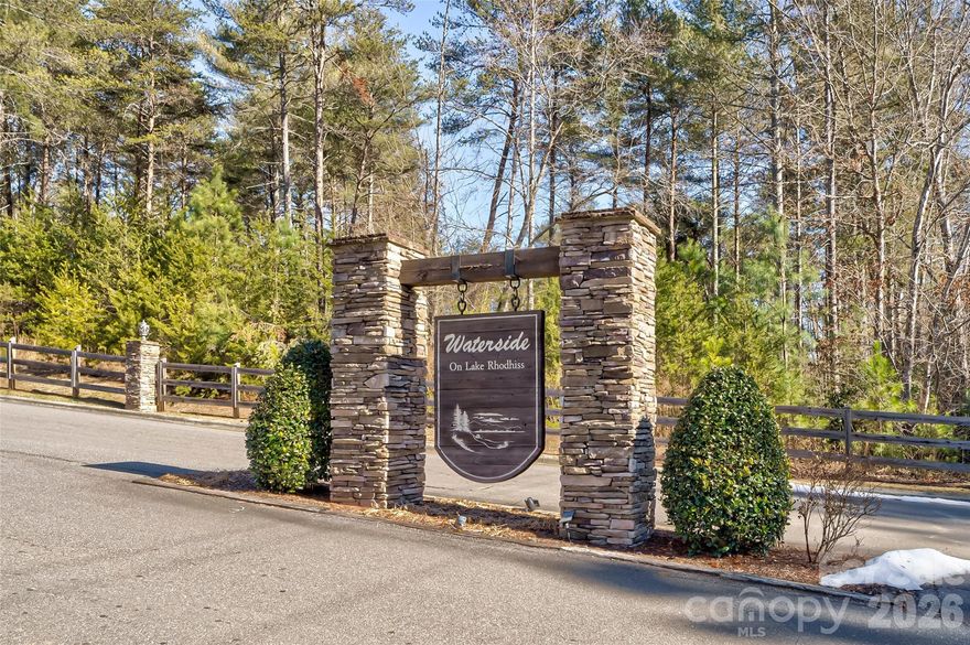 Discover the perfect setting for your dream home on this stunning 1.45-acre homesite in the Waterside Subdivision, ideally positioned between Valdese and Morganton. This community blends peaceful, nature-filled surroundings with everyday convenience. Residents enjoy amenities including community boat slips, a lakeside park, underground utilities, city water and sewer access at the street (tap fees required), plus city trash and recycling services. Experience the privacy of a secluded retreat while still benefiting from neighborhood comforts and modern infrastructure. Be sure to view the aerial tour to fully appreciate this exceptional property.