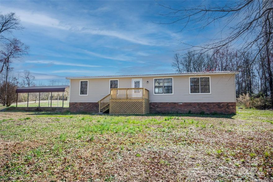 Multiple offers. Seller requesting highest and best offers by 5:00pm 3/27/24.  Great 3 bedroom 2 bath home recently fully remodeled! So many things are new! New kitchen cabinets and counter tops, sink, faucet, hood, washer, dryer, new laminate flooring throughout, new light fixtures and bathroom fixtures, new kitchen accent ceiling, and 3 new exterior decks! It's all almost like new! The kitchen is spacious with plenty of cabinets and open floorplan to the dining area and nice size living room. The primary bedroom has a walk in closet and private bath with awesome new tiled shower! So many nice features here! Situated on just over 1 acre, it has a large yard with a 2 car metal carport. There are other homes nearby but plenty of space outside as well. Located in the North Iredell middle & high school districts which are nearby as well. Quick access to I-77 and Statesville roughly 15ish minutes away.  Great price for a home that has been mostly made new. Come check it out!