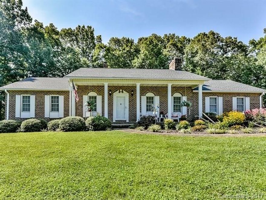 If you are looking for peaceful country living, look no farther! Featuring beautiful perennial flower garden, 2+ acres of land, covered porch & full heated basement! Brand new Flooring through the living room, dining room, & kitchen. Living room fireplace spans full length of the wall creating a warm welcoming home. Large bathroom w/ 2 showers, bath & dual sinks! Basement is heated w/ iron stove, has full bar setup, and access to back yard! Don't let this opportunity pass you by! 1 Year Warranty
