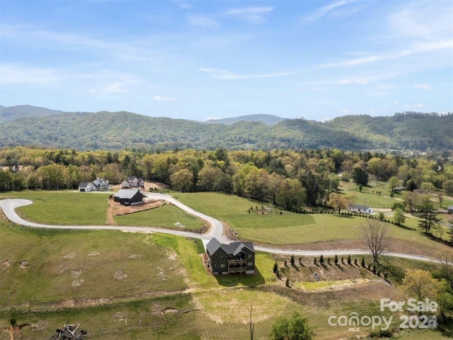 Experience the perfect mix of privacy, convenience, and natural beauty on Lot #15, the largest homesite in the sold out Hidden Meadows of Cane Creek Community. Already cleared with a septic permit, this one is ready to build on. The gently sloping build site boasts breathtaking long-range mountain and pastoral views with a small creek on the corner of the property. Just minutes from Asheville, Black Mountain, and Hendersonville, this prime location keeps you close to great local amenities while providing the space to create your personal mountain sanctuary. A consultation with a reputable builder is available upon request. Underground power and high-speed internet are available and there’s no time requirement to build. Don’t miss this rare opportunity to build your dream home in one of the region's premier communities.