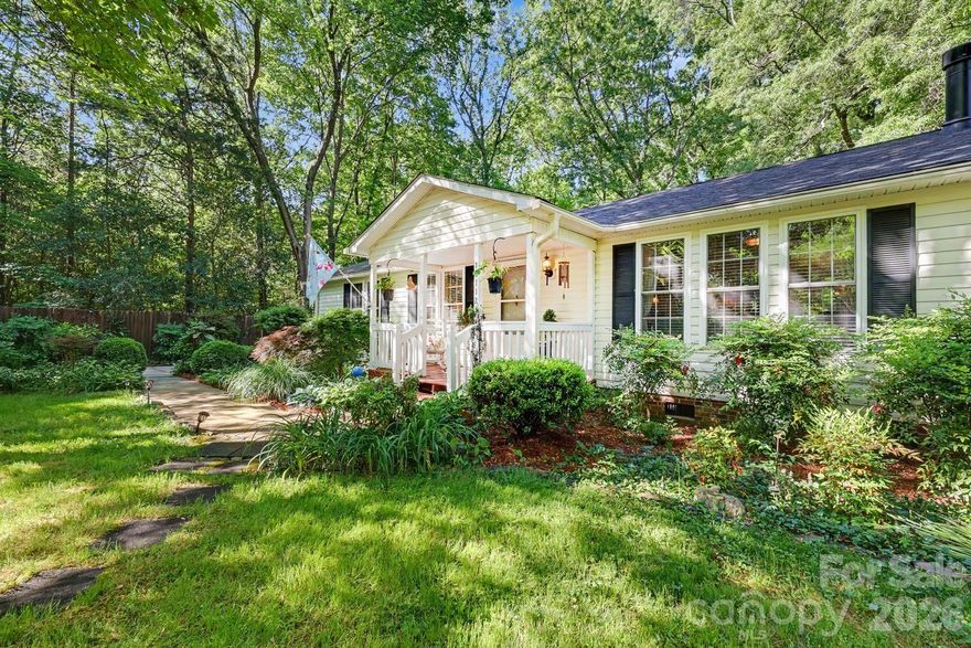 Tucked away on 2.7 (consisting fo 3 parcels) private acres in Matthews, this one-of-a-kind property offers a rare opportunity to enjoy a peaceful, nature-filled setting with established gardens, winding paths, and multiple outdoor living spaces.
Designed for those seeking a more intentional lifestyle, the grounds feature dedicated garden areas, mature landscaping, and space to create your own backyard retreat. A barnlike outbuilding provides flexibility for storage, workshop, or hobby use.
The home offers 4 bedrooms, split-bedroom layout. The 4th bedroom is currently set up as a home office with built-ins—ideal for remote work or flex space. The spacious primary suite features a large bath with walk-in shower. Wood flooring runs throughout, adding warmth and continuity to the living spaces.
Envision garden-to-table living, quiet mornings surrounded by nature, or simply room to breathe---only minutes aways from everyday amenities located near the corner of Idlewild Road and Margaret Wallace Road!