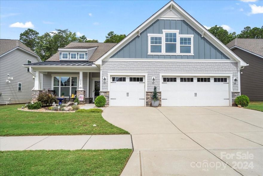 Welcome to your dream home! This Certified Green residence offers sustainable living without compromising luxury. The gourmet custom kitchen boasts pull-out shelving, a professionally done pantry, and custom window treatments. Enjoy seamless indoor-outdoor living with an extended patio featuring insulated windows, an electric retractable awning, and a gas fireplace. The rear porch/patio area, equipped with fans, provides year-round comfort. Inside, the living room features an upgraded stone electric fireplace with a heater.

This immaculate home features two primary bedrooms with en-suites, hardwood floors run throughout, with cozy carpeting in the guest rooms. Custom closets, a drop-off zone, and garage cabinets offer ample storage. The three-car garage provides plenty of space for vehicles and projects. Located in a gated community with a 24-hour on-site guard, this home offers both peace of mind and exclusivity.