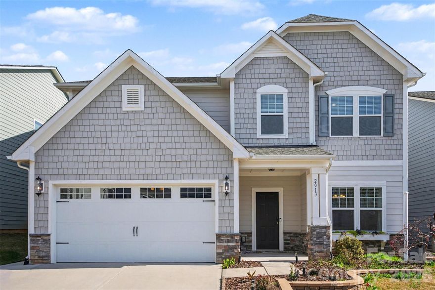 Be on Lake Wylie or the Catawba River in under five minutes from your front door. Covered patio built for game days. Main-level guest suite.
This Lake Ridge home checks boxes most buyers don’t find in one place.

Five bedrooms with a main-level guest suite and adjacent full bath, perfect for visitors, long-term guests, or a private home office. Open kitchen with gas range, granite counters, stainless appliances, and center island seating four flows into the generous living room with fireplace. This is where life happens.

Upstairs primary suite delivers the retreat you’ve been picturing: walk-in closet, dual vanities, soaking tub, separate tile and glass shower, and space for a sitting area or morning coffee spot. Three additional bedrooms plus a bonus room give everyone room to spread out, playroom, home gym, or flex space, your choice. Built-in drop zone with bench and hooks keeps daily life organized. Laundry room with folding counter and cabinets makes the mundane manageable.

The backyard is the closer. Covered patio with pergola, ceiling fan, string lights, and TV mount overlooks a fenced yard with extended paver patio, set up for almost year-round use. Oversized garage with epoxy floors fits the vehicles and the gear.

Located in South Carolina with comparatively lower property taxes than neighboring North Carolina.

Close to Catawba Park, Carowinds, Baxter Village, and Kingsley shopping and dining. Lake Ridge amenities include pool with slide and separate kid pool, basketball court, tennis/pickleball courts, bocce, clubhouse, fitness center, and paved trails. Fort Mill schools are nearby and easily accessible.

Approx. 25–30 minutes to Uptown Charlotte and 25–35 minutes to Charlotte Douglas International Airport with easy access for commuting and travel.

Homes with this combination of layout, condition, location, and outdoor living move fast in Lake Ridge. Schedule your showing.