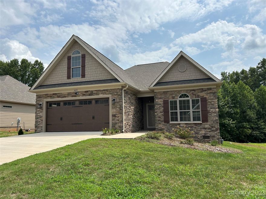 " Villas on the Creek " new 55 Plus community located conveniently to hospital, shopping, and downtown. Designed for ease of livability with features including : no step entry from garage, 36" wide passageways, LVP flooring throughout living area, LVT flooring in baths, custom cabinets in kitchen and baths with granite tops and soft close cabinetry, custom trey ceilings in den and primary bedroom. Home is located on quiet street with a creek along rear portion of lot and protected wooded area for privacy. HOA fee covers lawn care.