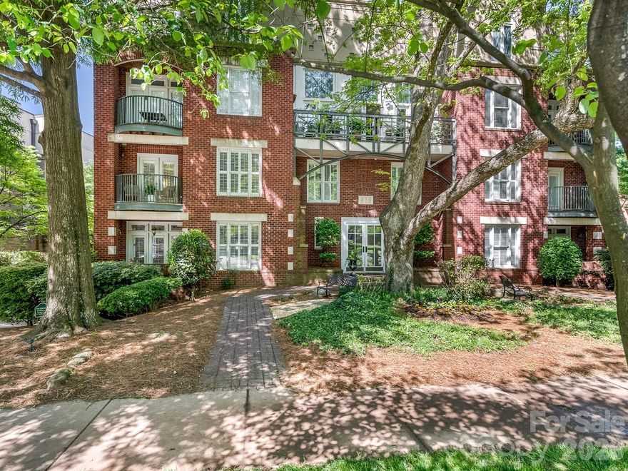 Beautiful two-story condo on tree-lined Queens Rd, right in the heart of Myers Park. This condo has it all… new flooring, new paint, an updated gas fireplace surround, new cabinets/bookcases, newly painted kitchen cabinets, new dishwasher and stainless steel appliances. The living room and dining room are perfect for entertaining and lead to a nice covered porch. Walk up the stairs and notice the new designer runner. Second level boosts an updated primary bedroom with 2 closets and access to another private balcony. The ensuite bath is complete with quartz countertops, double sinks and a walk-in shower w/ marble flooring. There is a 2nd bedroom and 2nd full bath in the hallway as well as the laundry room. Great space for an office, guests, or gym. Secure building with gated and covered parking. One deeded parking space with this unit and additional parking is available. Great storage within the unit plus a dedicated storage closet in the main hallway, 2 doors down. Conveniently located to hospitals, Uptown, Midwood, great restaurants, shopping and the Greenway.