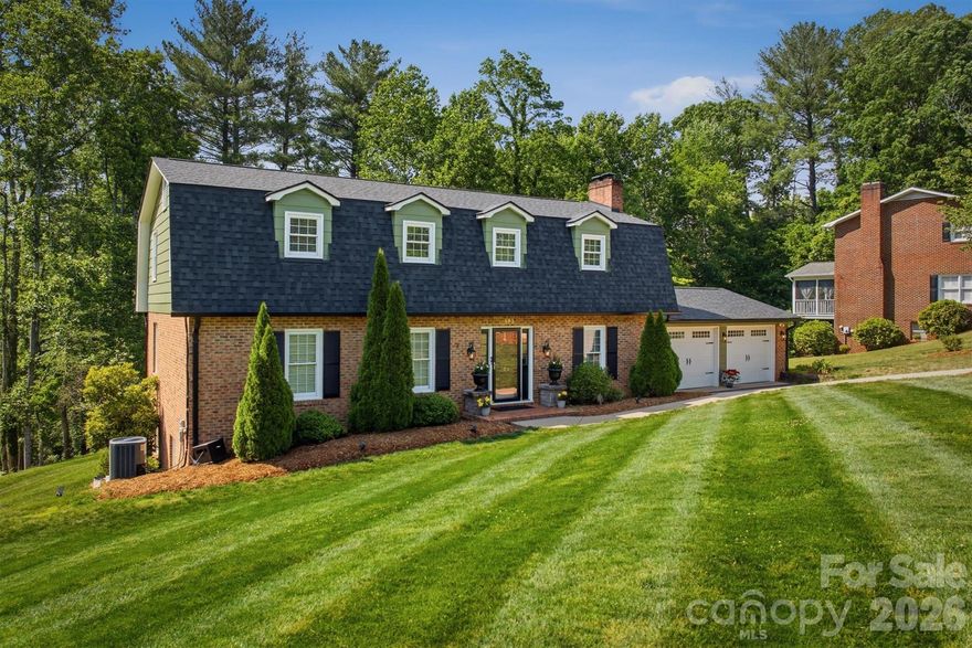 Located in a great neighborhood just minutes from Downtown Morganton, this 4-bedroom home offers a wonderful blend of space, functionality, and timeless charm. Step inside to an elegant first impression featuring a winding staircase that welcomes you into the home.

The updated kitchen showcases beautiful countertops that continue into the backsplash, creating a clean and elevated look. Enjoy both an eat-in kitchen and formal dining room, giving flexibility for everyday living and entertaining alike. Step out onto the large back deck overlooking the private backyard. The spacious living room provides plenty of room to gather, while the cozy den features a fireplace and built-in shelving, making it an ideal second living area, home office, or reading room. A convenient half bath for guests and the laundry room are also located on the main level.

Upstairs, all four bedrooms are thoughtfully situated together, including a well-appointed primary suite featuring dual sinks, a soaking tub, and separate shower. Three additional bedrooms and a full hall bathroom complete this level.

The finished basement features a recreation room complete with a full bathroom, offering endless possibilities for entertaining, hobbies, guests or flex space. From here, step out onto the covered patio tucked beneath the back deck, creating multiple spaces to relax and enjoy the outdoors.

Situated on a generous corner lot, this property offers plenty of room to enjoy outdoor living. The main-level 2-car garage provides everyday convenience, while the additional basement garage is perfect for lawn equipment, workshop space, or extra storage.

From its flexible floor plan to its sought-after location near Downtown Morganton, this home is ready to fit a variety of lifestyles.