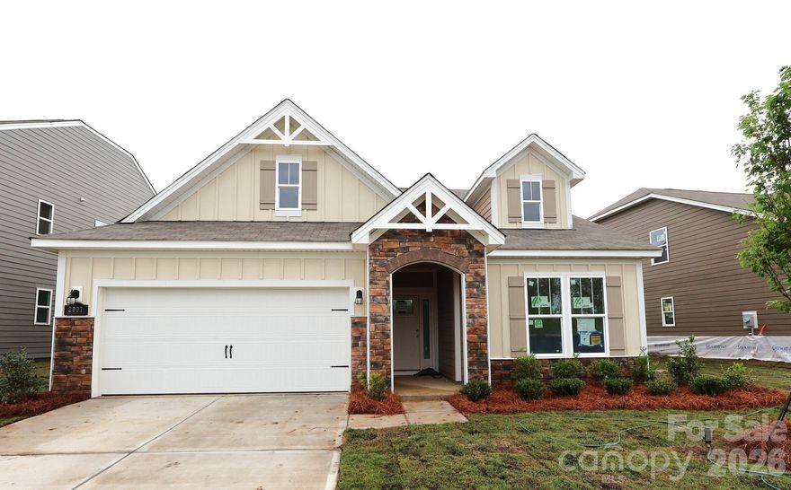 Welcome to the Meadow! Walking in from the front covered porch you are greeted with a warm and inviting foyer. Just off the foyer are two secondary bedrooms with a full shared bathroom nestled between. The home opens up into your family room, kitchen and breakfast area. You'll notice the main areas of this home have been finished with easily maintainable EVP flooring and 2" faux wood blinds have been accented throughout. The kitchen is ideal for a chef, featuring quartz countertops, stainless steel appliances, a French door refrigerator and a kitchen island with a sink. The family room is flooded with natural lighting and is spacious enough to fit a sectional sofa and other furniture. Through the sliding glass door is a covered lanai, ideal for entertaining or enjoying a morning coffee. The laundry room is located just off the garage entrance and has been completed with a full size washer and dryer. To finish this level is the Owner's suite with mazimum space and comfort. The ensuite features a tiled standing shower, separate vanities and a private toilet area to allow everyone privacy and space to get ready in the mornings. The two walk-in closets are sure to accommadate any size wardrobe. Upstairs is a sizeable bonus room, ideal for movie nights or just an additional space to entertain. Another secondary bedroom and a full shared bathroom will finish the level. Welcome to your new home!