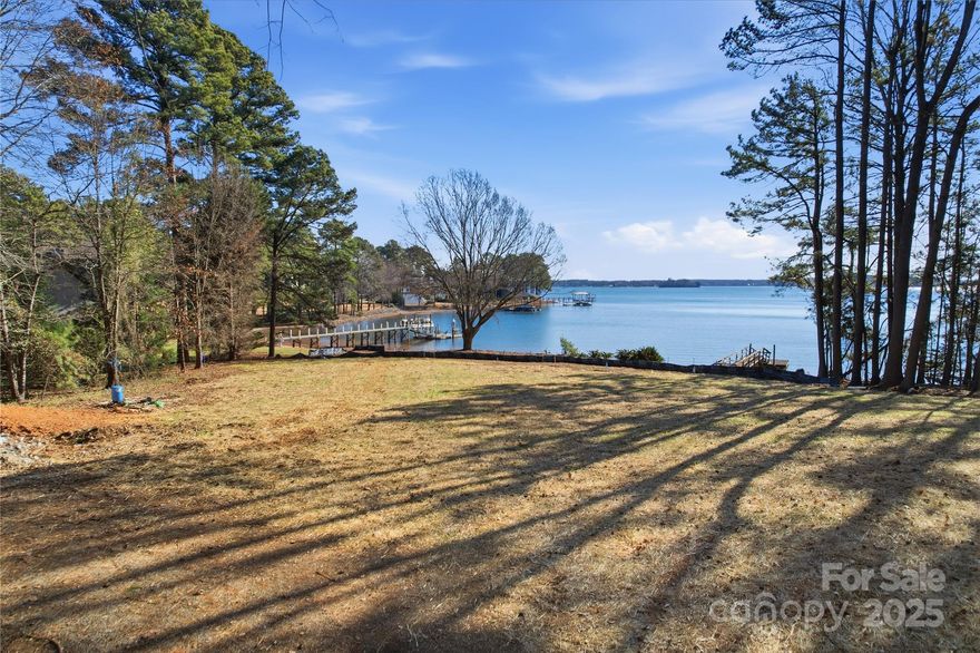 Enjoy breathtaking water views from this nearly one-acre waterfront homesite on iconic Lake Norman, offering an exceptional opportunity to build the custom lake home you’ve always envisioned. With 165.57 feet of shoreline and 60.26 feet of road frontage, this property provides both presence on the water and easy access from the street. Out with the old, in with the new!!! The tear-down home has been fully removed, and the lot thoughtfully prepped, allowing you to move forward with confidence. The existing dock conveys as-is. seller has applied for new dock & dredging permit. New survey available, along with a septic improvement permit for a 5-bedroom system to be installed. A stunning luxury floor plan by KDH Design Residential, optimized for this lot, has been selected for your review and customization (or bring your own plan) should you choose to work with Courtland Homebuilders, a name synonymous with quality and craftsmanship across the region. Situated in a wonderful location with no HOA dues, yet just minutes from Trump National Golf Club Charlotte where memberships are available if you desire premium amenities. All showings are by agent-accompanied appointment only. Come build your dream, embrace the views, and live the lake life you’ve been waiting for on beautiful Lake Norman.