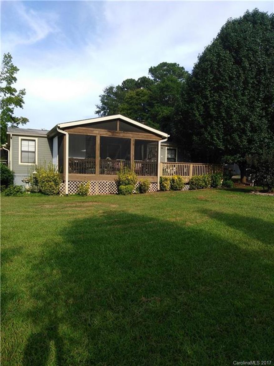 Tranquility abounds at this wonderful country home. Updated Kit (2015) includes stove, microw/convection combo, d/w, refrig,  new cabinets, backsplash, counters.  Master was updated 2016 for handicap accessibility.  State of the art security security system, Huge 20x20 GR w/ electric f/p, laundry room with W/D & pantry,  Screened front porch overlooks huge front yard with Peach, fig & pomegranate trees.  Side porch overlooks patio. Wired Bldgs, RV hookup, paved drive.  Come look & Make an offer!