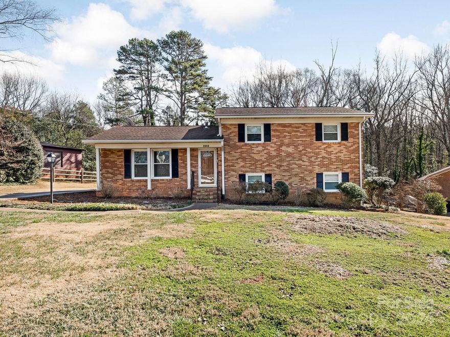 Beautiful brick home is freshly renovated with richly finished oak hardwood floors that flow throughout Living Room and upstairs Bedrooms. Your favorite cook will enjoy the easy clean appliances, ample storage & counters while watching backyard action from the Kitchen window. Interior spaces are sunny and bright with lots of ceiling fans, and energy-saving features to keep utility and maintenance costs down. Large deck extends life outside with plenty of space for grilling and umbrella dining with your favorite crowd of friends. Deep yard is equally fun for gardening, ballgames & big dogs. Private, quiet cul-de-sac neighborhood is convenient to Charlotte parks and expanding greenway trail network with diverse options to run, bike, walk and relax. Great local shops, restaurants, bars & services perfectly complement your Urban Charlotte lifestyle. 1.5 mi to light rail, 5 to Uptown, & 7 to CLT International Airport. This home and location have so much to offer; see it for yourself today!