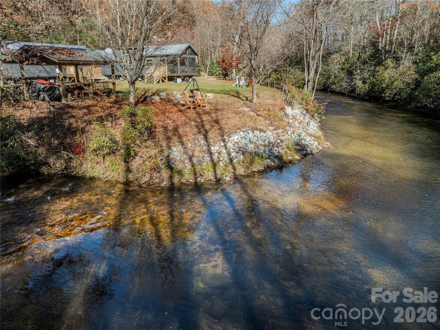 A fly fishing paradise on one of the most beautiful stretches of trout waters in Western North Carolina, this vacation fishing camp is the perfect spot for outdoorsmen looking to spend time on the bold East Fork of the French Broad River. The NC Wildlife Resources commission stocks annually over 17,000 brook, rainbow and brown trout along this stretch of delayed harvest designated trout waters. The stream-side cabins sleep six and are comfy and livable, with wood accents, full kitchens and baths, and easy parking. The riverside features an open shed, fire pit, picnic and open lawn areas as well as direct access to the tumbling river. This section of the East Fork is noted for its beauty and fishing, with cascades, runs, pools and holes brimmming with trout. 

Nearby Rosman and Brevard provide shopping, fine dining, live music, art galleries and antique stores, and a vibrant small-town Appalachian culture. Trailheads at Headwaters State Forest are just over 2 miles away to the south, and the vast acreages of Pisgah National Forest are just 5 miles to the north.
