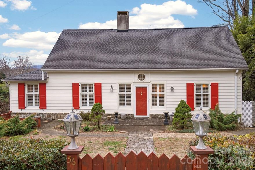 Rare opportunity to step into a home perfectly set up for urban homesteaders! Gorgeous, well-maintained Colonial is located mere seconds from downtown Tryon. Natural light pours through the windows, many of which have custom wood shutters. Expansive living room with warm hardwood floors, wood stove insert, and beautiful mantel. The living room flows into the dining area, which is adjacent to the well-designed galley kitchen. The private owner's suite is quietly situated away from the living areas. The owner's suite includes a walk-in closet, small linen closet, en-suite bathroom, and bedroom which opens into the screened porch. The second and third bedrooms each have their own sitting rooms, which could also be used as offices, libraries, or music rooms. A Jack & Jill bathroom connects these two bedrooms. Solar panels provide the majority of the electricity - any excess is sold back to Duke. Sellers were very energy efficient, utilizing the wood stove in the winter, ceiling fans, and enjoying the cool downstairs lounge area during the summer. Last year's electric bills only totaled $321.36 for the YEAR! The natural gas bill was only $477.74 for the year! Lush front planting beds are filled with perennials with stone and brick-lined walkways. The fenced back yard contains a raised bed garden, blueberry bushes, and blackberry vines.