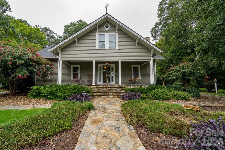 Located on over 7 acres in the western part of Stanly County, this home boasts many characteristics that you need to see to fully appreciate. Renovations were previously done by the owner's parents and make this lovely home truly move-in ready!  The main floor includes open spaces with a cozy living room featuring a beautiful stone fireplace, dining space and lovely kitchen. Need additional space for all of your pots and pans, small appliances? Check out the adjacent pantry with ample shelving and storage room. The spacious primary bedroom is conveniently located on the main level and has a full attached bathroom/laundry space. Built in 1917, this home has 725 feet of heated, finished space upstairs that cannot be advertised as HLA due to the ceiling height being just under 7 feet. There are two bedrooms and a full bathroom located on this upper floor as well as an additional room with a closet and window that can function as multiple purposes. Partial to the outdoors? Check out the newly built, grand patio on the side of the house, perfect for entertaining or just quietly relaxing after a long day! A very nice, large outbuilding and two other structures provide plenty of room for storage or other versatile uses. This is a truly unique property! Schedule your appointment today!