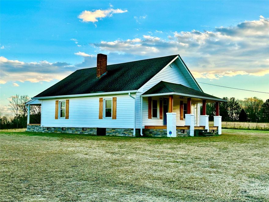 The most beautiful country setting I've saw in a while, 2 acres set right in the middle of pastures! This adorable 100 year old farmhouse has been brought back to life and is ready for the next 100 years! Updates include siding, stone veneer of crawl space, new windows and doors, moisture barrier, new over-sized electric HVAC, gas tankless water heater, new fixtures throughout, LVP flooring, fresh paint and new kitchen and bath. The roof is approximately 10 years old. The well was upgraded with new underground electric, new pump, and is housed in the cutest insulated "outhouse". All appliances in the kitchen and washer and dryer remain. There are no restrictions in this rural area so farm animals are ok.